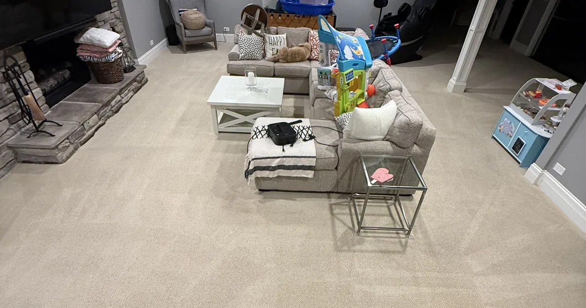 Freshly cleaned light beige carpet in a finished Glenview basement family room