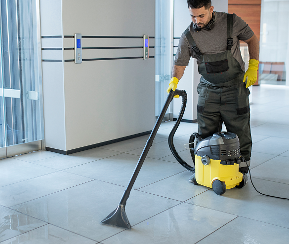 man cleaning lobby area in a commercial building
