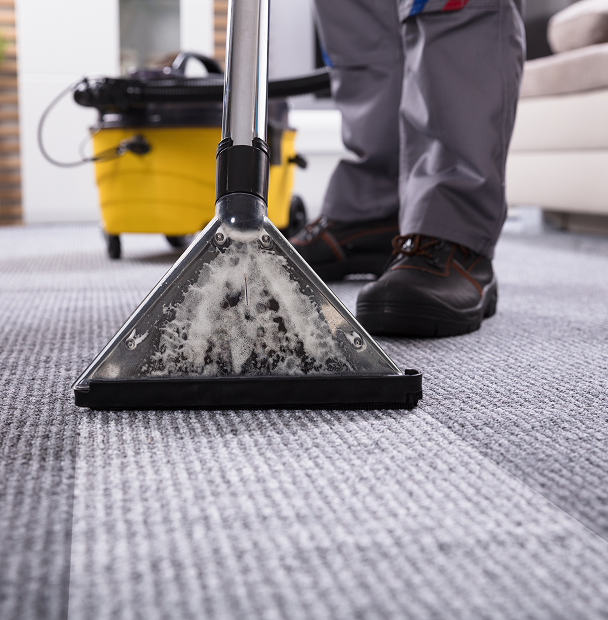 man cleaning carpets