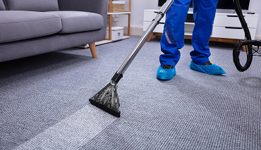 man cleaning carpet in Chicago