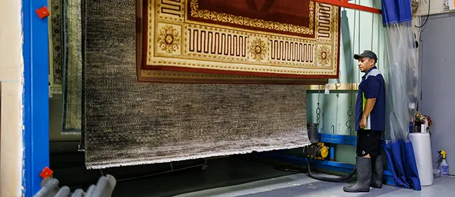rugs hanging on the drying racks