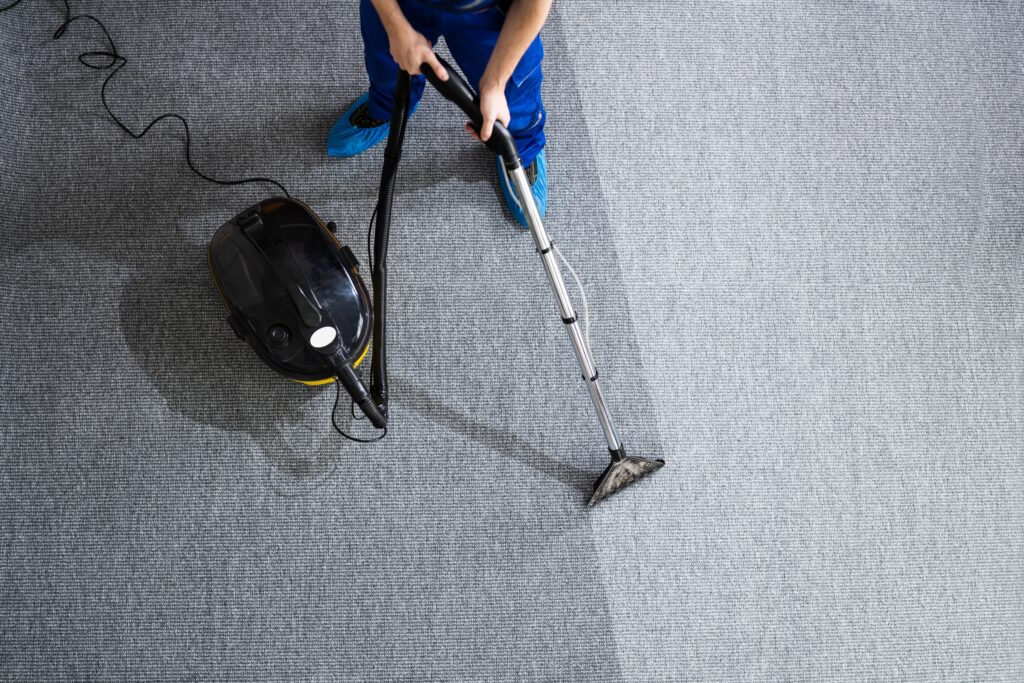 janitor cleaning carpet