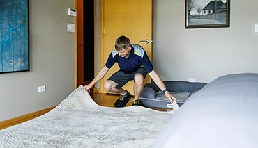 cleaner laying clean rug