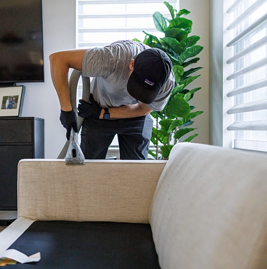 technician cleaning upholstery