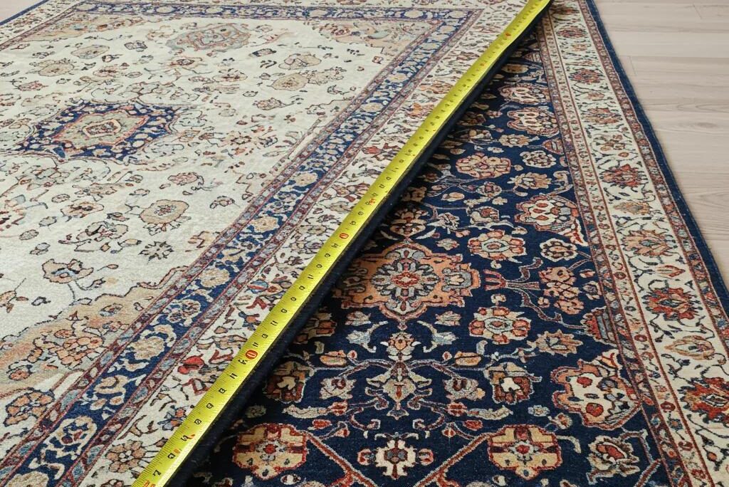 Measuring tape next to various sized rugs, illustrating the relationship between rug size and cleaning costs
